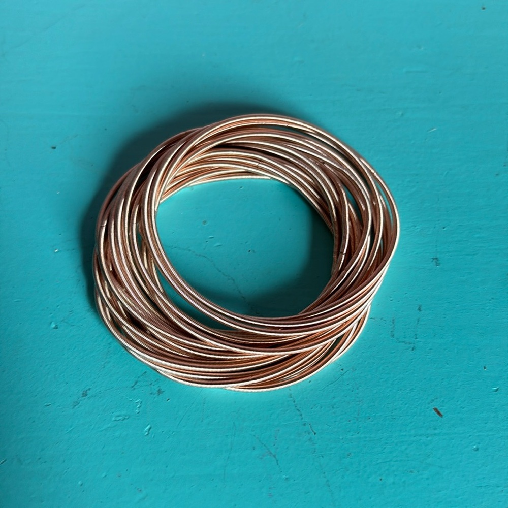 Beautiful guitar string rose gold bracelet’s.Listing includes 20 bracelets